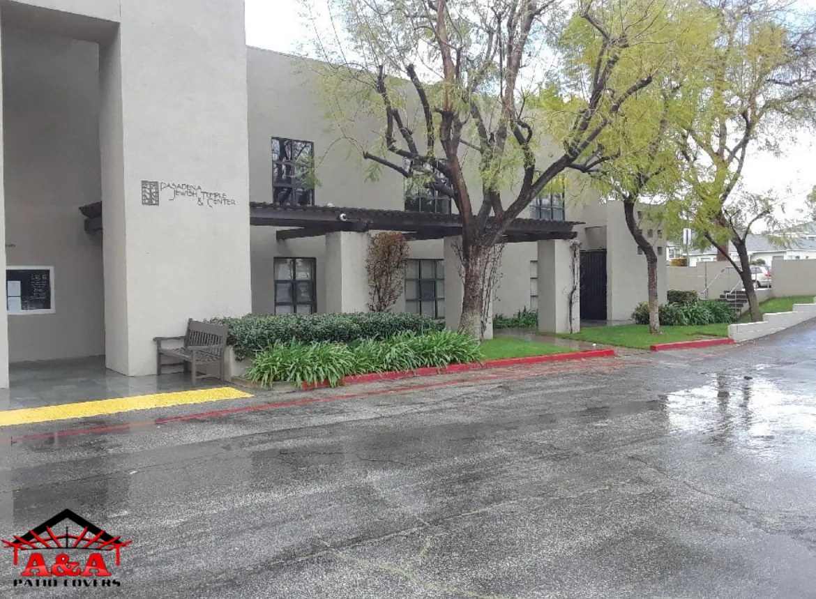 Covered walkway at an apartment community on a wet winter day