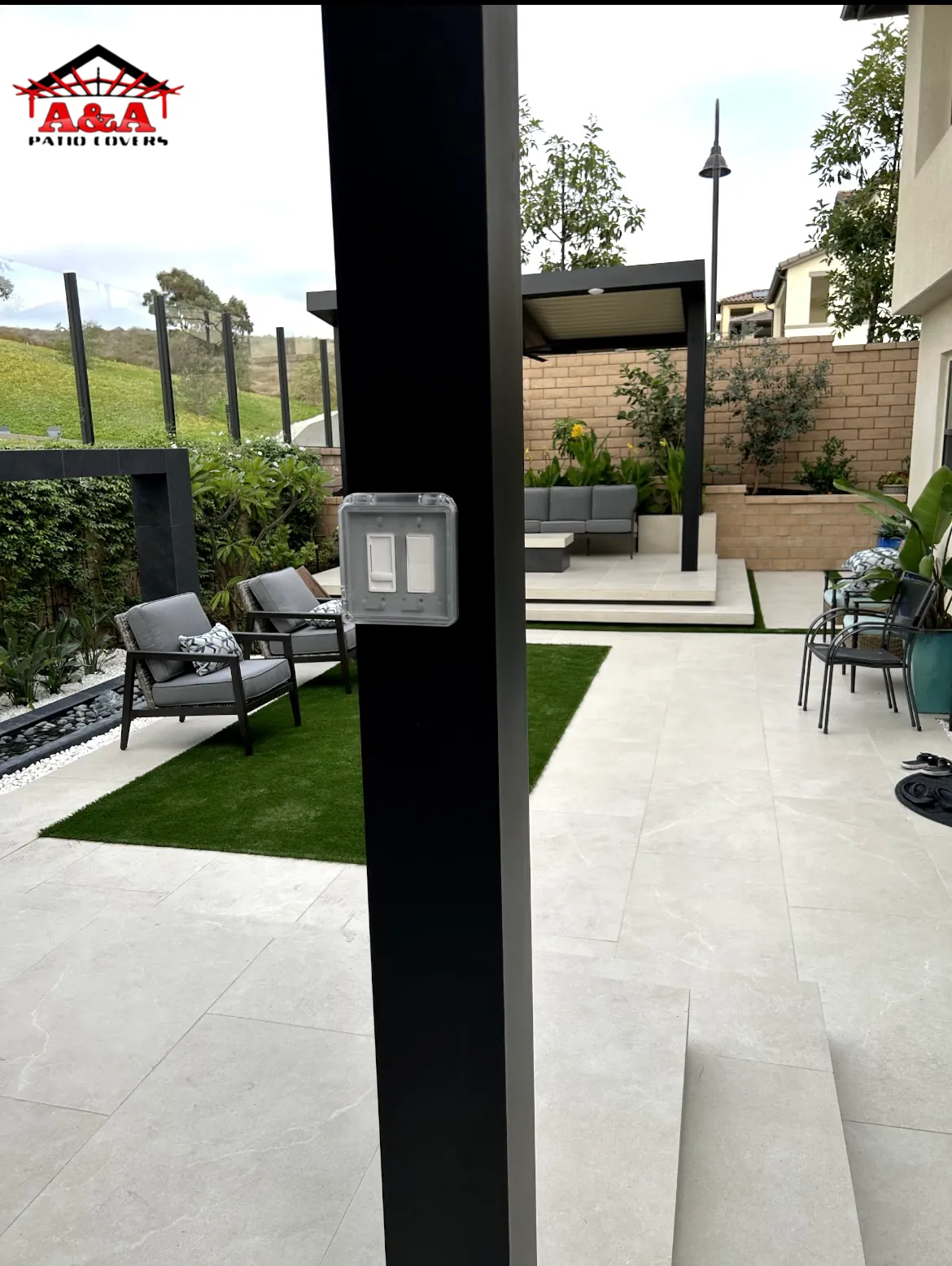 Compact covered patio over artificial turf in a side yard
