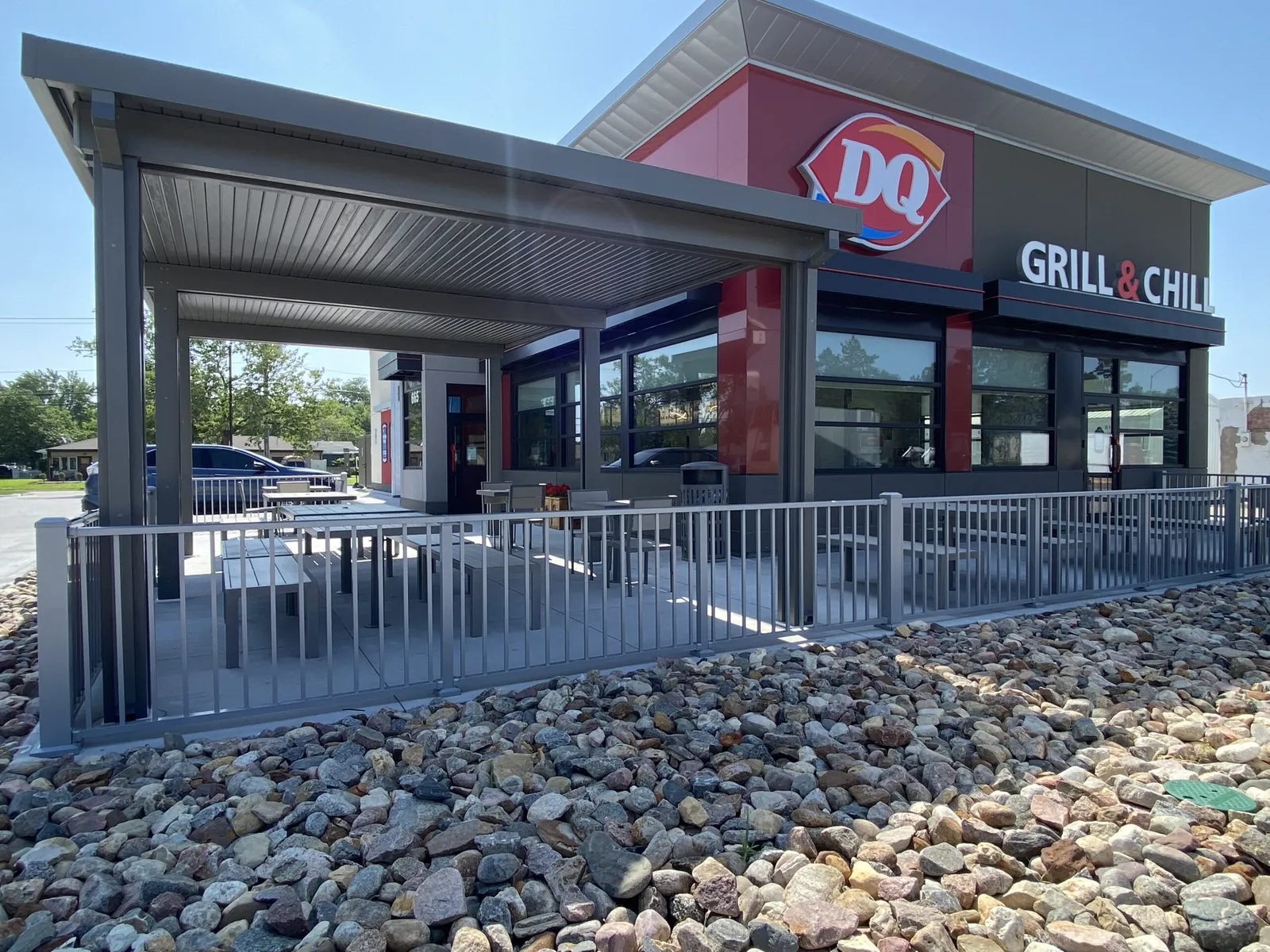 Storefront canopy and patio railing at a DQ Grill & Chill restaurant