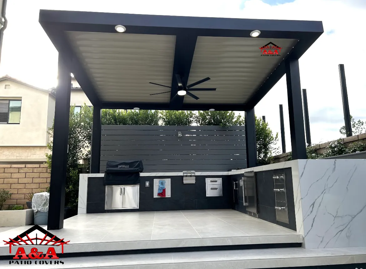 Freestanding black and white patio cover over a built-in outdoor kitchen
