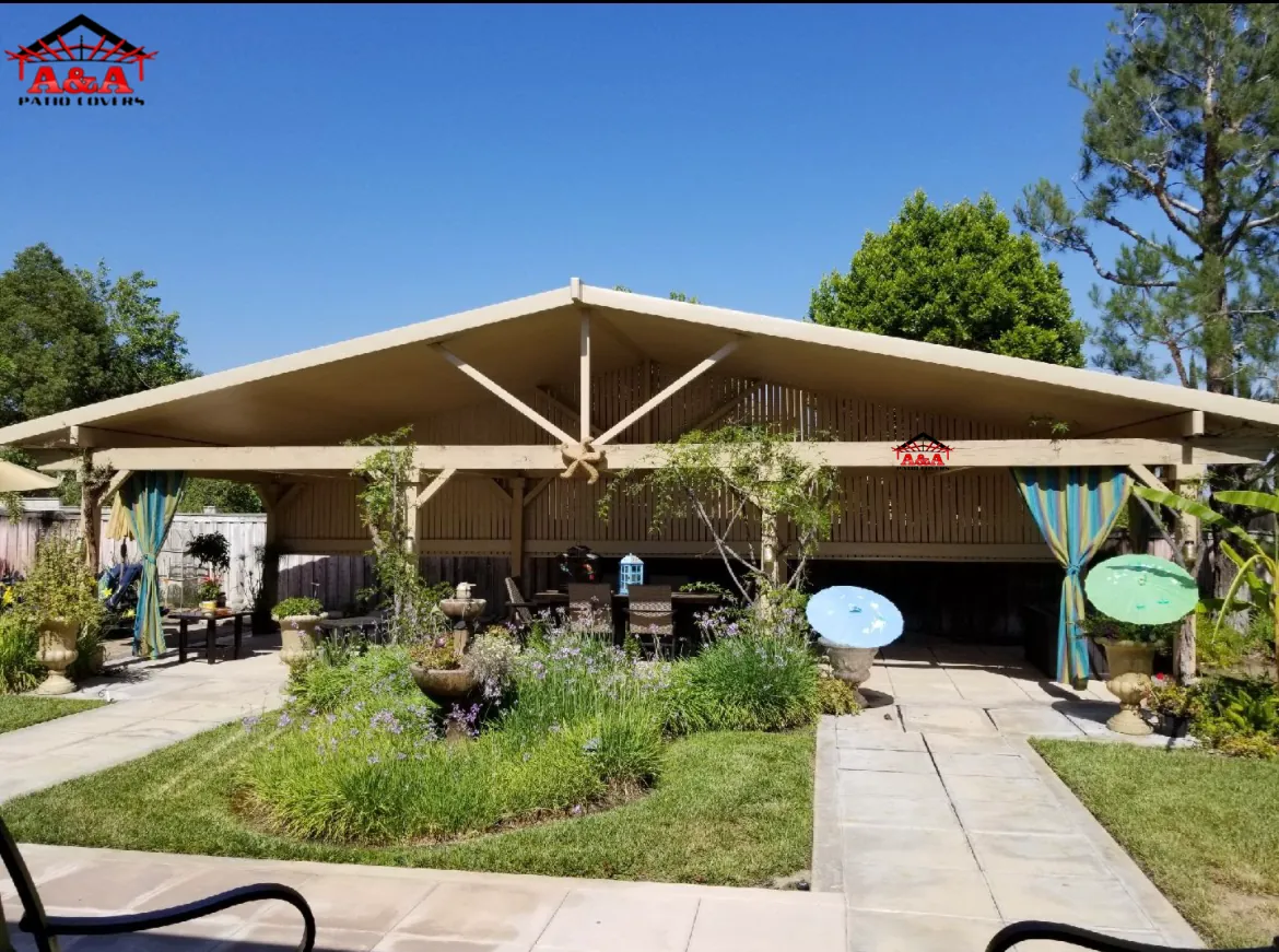 Gable-roof patio cover over a landscaped outdoor living area